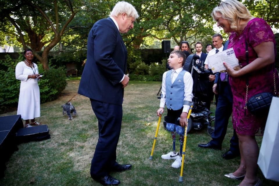 Prime Minister Boris Johnson talking to Tony Hudgell (Peter Nicholls/PA) (PA Wire)