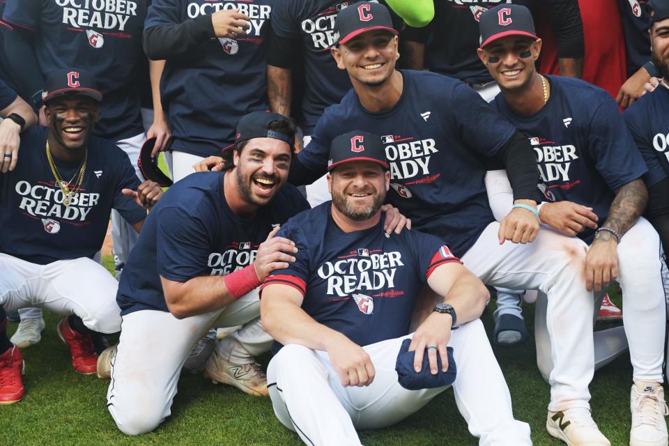 Cleveland Guardians manager Stephen Vogt, middle, celebrates with players after the Guardians beat the Minnesota Twins on Thursday in Cleveland to clinch a playoff berth.