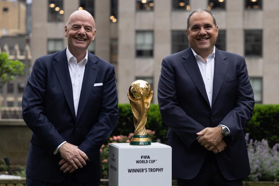 FIFA President Gianni Infantino (L) and CONCACAF President Victor Montagliani (R) pose with the FIFA World Cup trophy during an event in New York after an announcement related to the staging of the FIFA World Cup 2026, on June 16, 2022.