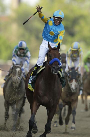 Victor Espinoza rides American Pharoah to victory in the 141st running of the Kentucky Derby. (AP)