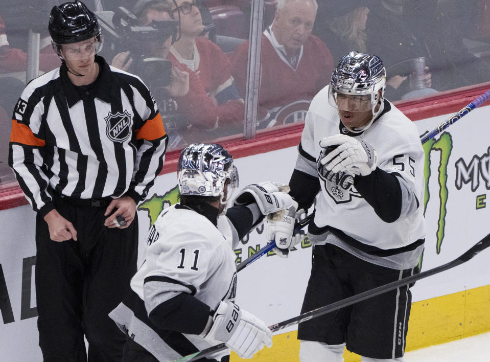 Los Angeles Kings' Quinton Byfield (55) celebrates his goal against the Montreal Canadiens with Anze Kopitar (11) during the second period of an NHL hockey game Thursday, Dec. 7, 2023, in Montreal. (Christinne Muschi/The Canadian Press via AP)