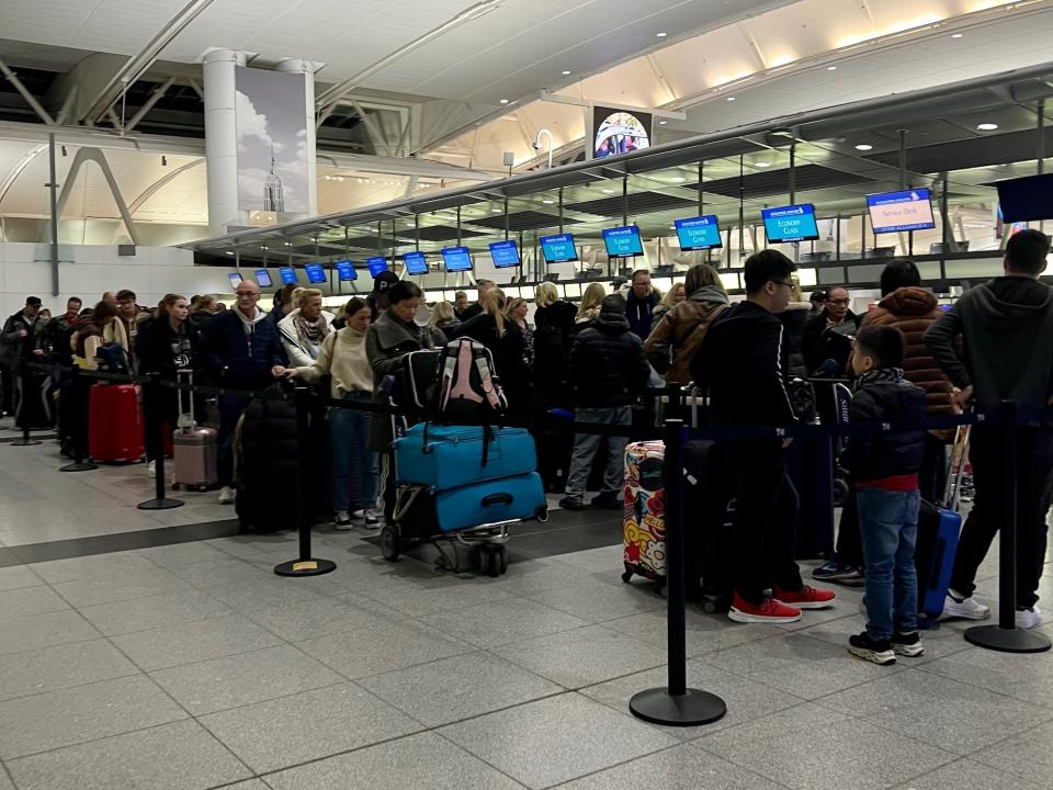 The snaking line of passengers in Singapore's economy check-in queue.