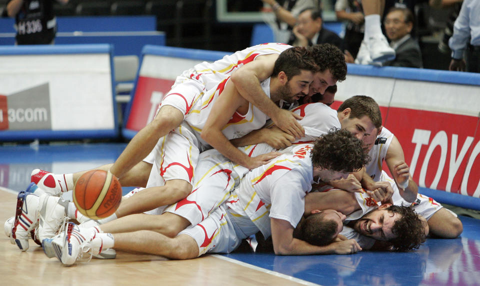 FILE - In this Sept. 1, 2006, file photo, Spain team members celebrate after defeating Argentina in the semifinals of the World Basketball Championships in Saitama, Japan. The 2006 world championship was perhaps the last truly wide-open international basketball event. Argentina arrived as the Olympic champion and Spain left as the world champion, the last time for a long while anyone other than the U.S. would hold either title. (AP Photo/Mark J. Terrill, File)