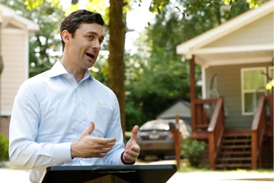Sen. Jon Ossoff, D-Ga., talks about the federal resources that will aid Athens Area Habitat for Humanity in building 40 homes in the Gaines School Elementary School district of Athens, on Wednesday, May 24, 2023.