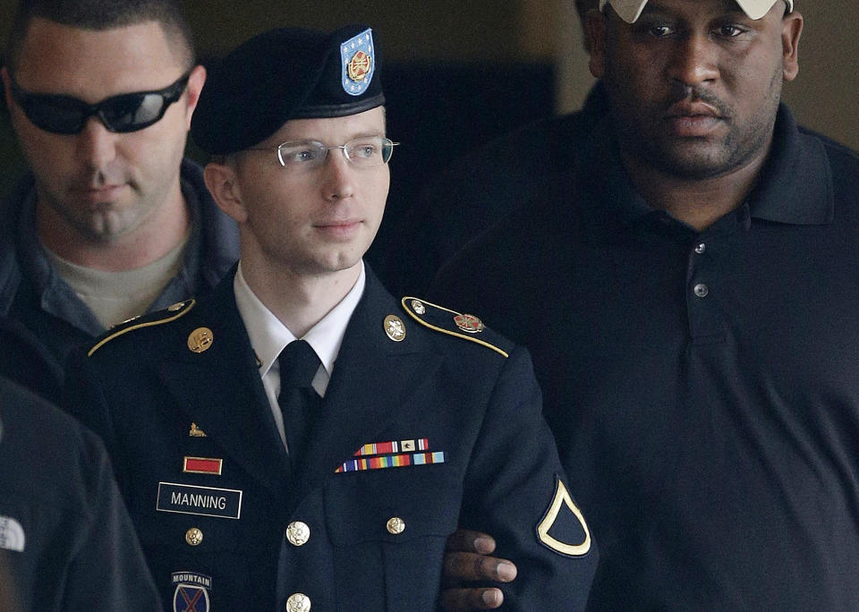 FILE - In this Tuesday, Aug. 20, 2013, file photo, Army Pfc. Bradley Manning is escorted to a security vehicle outside a courthouse in Fort Meade, Md., after a hearing in his court martial. A northeast Kansas judge will make a final determination Wednesday, April 23, 2014, on Manning’s request to change her name from Bradley Edward Manning to Chelsea Elizabeth Manning. Manning is serving a 35-year sentence for giving reams of classified U.S. government information to the anti-secrecy website WikiLeaks. (AP Photo/Patrick Semansky, File)