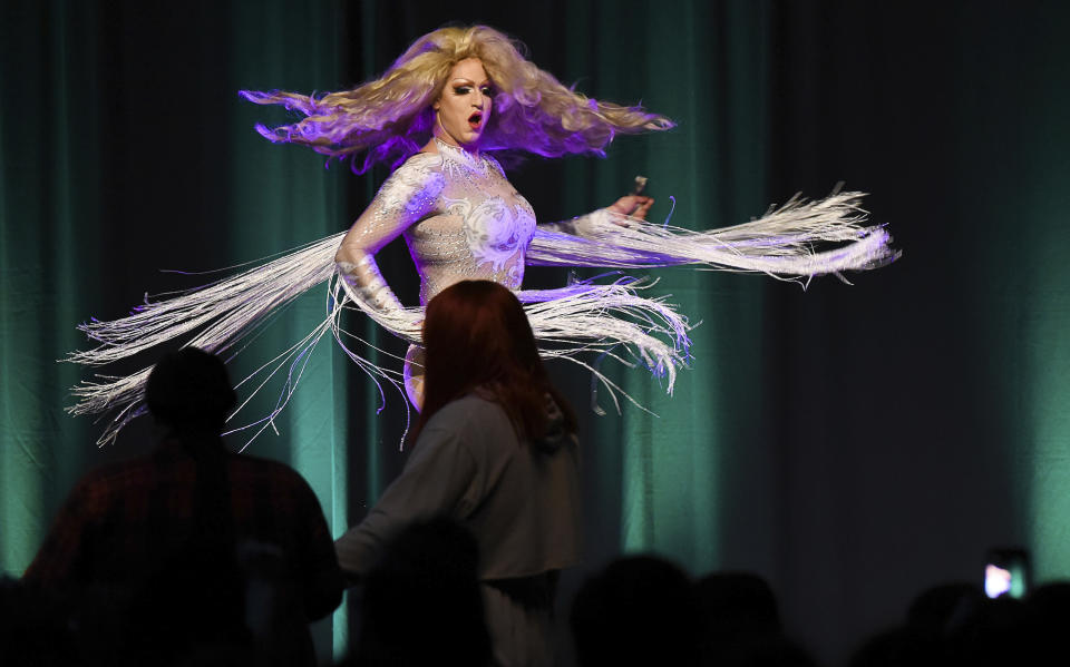 FILE - Kyel Beardall lights up the stage as Emerald Fantom Daaé before a packed ballroom at the Taggart Student Center at Utah State University in Logan, Utah, Nov. 15, 2018. A federal judge has granted the request Friday, June 17, 2023, of an Utah-based group that organizes drag performances for a preliminary injunction, directing the city of St. George to issue a permit for the group to host an all-ages drag show in a public park and calling the attempt of city officials to stop the show unconstitutional. (Francisco Kjolseth/The Salt Lake Tribune via AP, File)