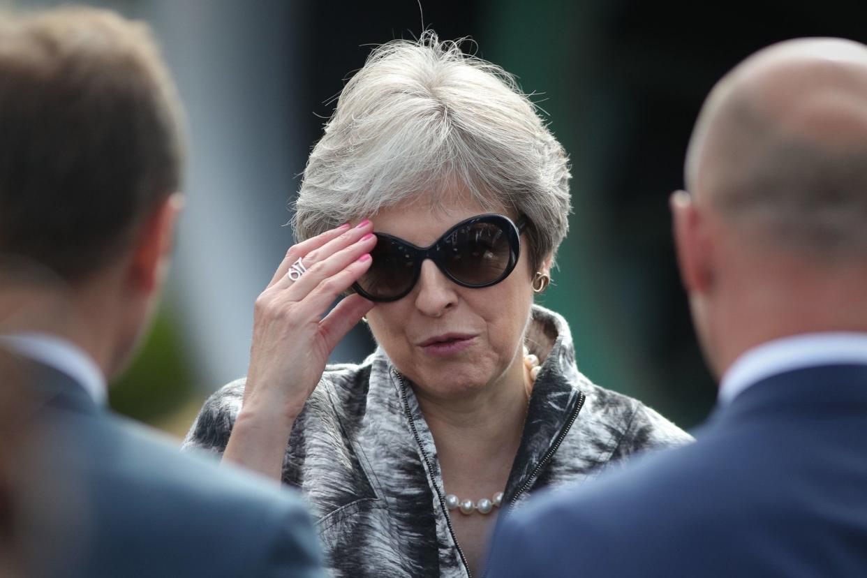 Away from the glare: Theresa May attended the Farnborough Air Show this week while rebel Tories were narrowly defeated in a bid to amend her policy on Brexit: PA