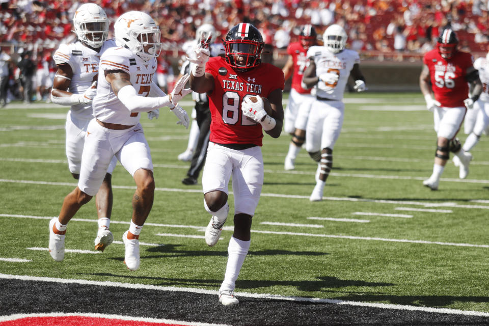 Texas Tech wide receiver Kesean Carter holds up two fingers as he scored his second touchdown of the game during the first half of an NCAA college football game against Texas Tech, Saturday Sept. 26, 2020, in Lubbock, Texas. (AP Photo/Mark Rogers)