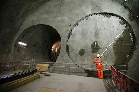 A worker surveys a tunnel entrance at Crossrail's Stepney site in east London September 25, 2013. REUTERS/Andrew Winning