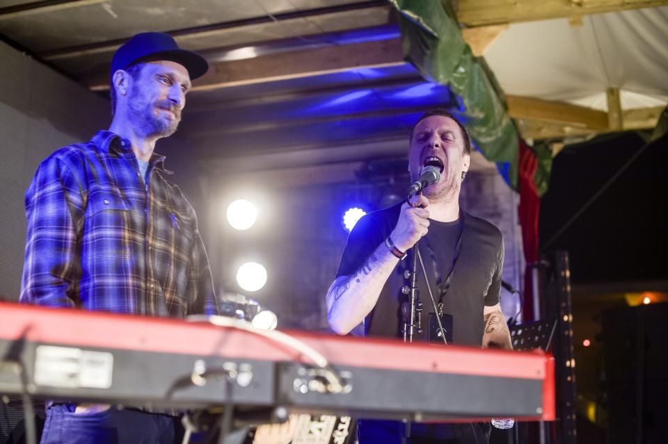 Sleaford Mods vocalist Jason Williamson, right, and musician Andrew Robert Lindsay Fearn, performing at Banksy's Dismaland, Weston-super-Mare.