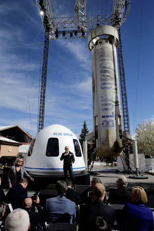 Amazon and Blue Origin founder Jeff Bezos addresses the media about the New Shepard rocket booster and Crew Capsule mockup at the 33rd Space Symposium in Colorado Springs, Colorado, United States April 5, 2017. REUTERS/Isaiah J. Downing