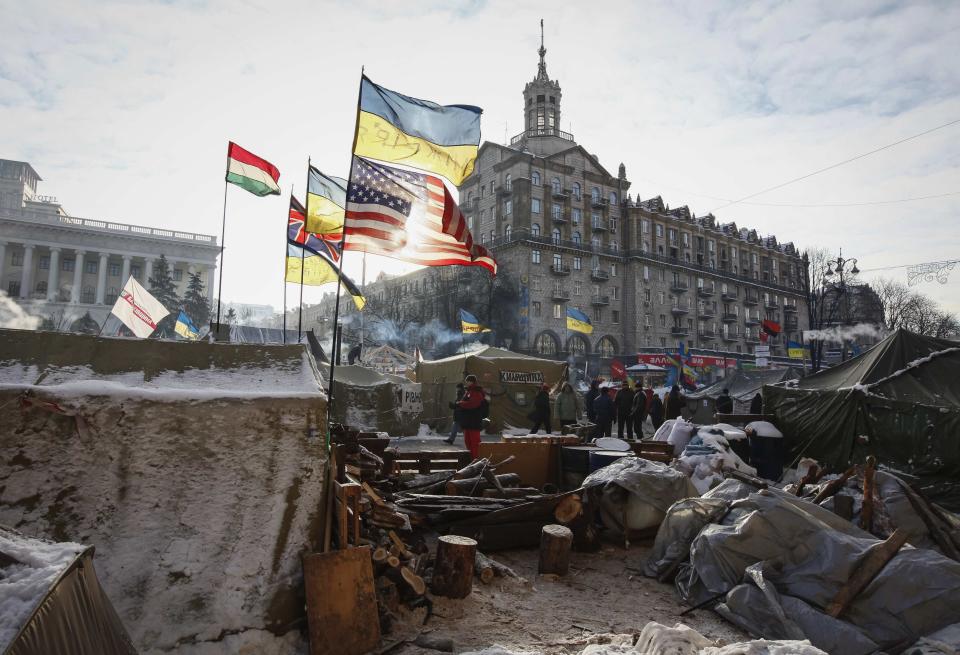 Flags are seen over tents of anti-government protesters camping at the Independence Square in central Kiev