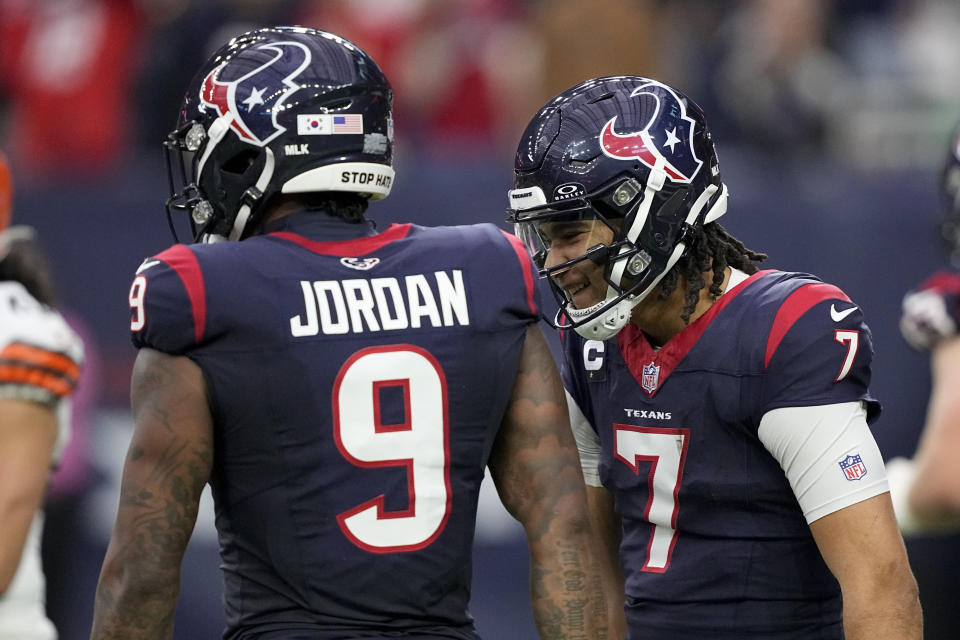 Houston Texans tight end Brevin Jordan celebrates after scoring with quarterback C.J. Stroud during the first half of an NFL wild-card playoff football game against the Cleveland Browns Saturday, Jan. 13, 2024, in Houston. (AP Photo/David J. Phillip)