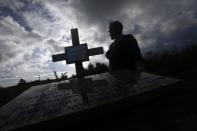 Anna McShane stands November 4, 2014 at the location where her father Charlie Armstrong's remains were discovered in County Monaghan. REUTERS/Cathal McNaughton