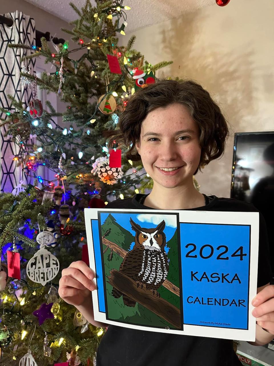 Myka Glada,17, holding the calendar she created.