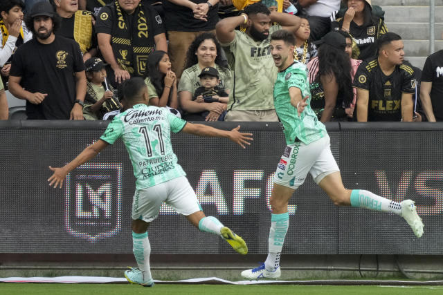 Le&#xf3;n midfielder Lucas Di Yorio, right, celebrates with midfielder Elias Hernandez (11) after scoring a goal against Los Angeles FC during the first half in the second leg of a CONCACAF championship final soccer match, Sunday, June 4, 2023, in Los Angeles. (AP Photo/Marcio Jose Sanchez)