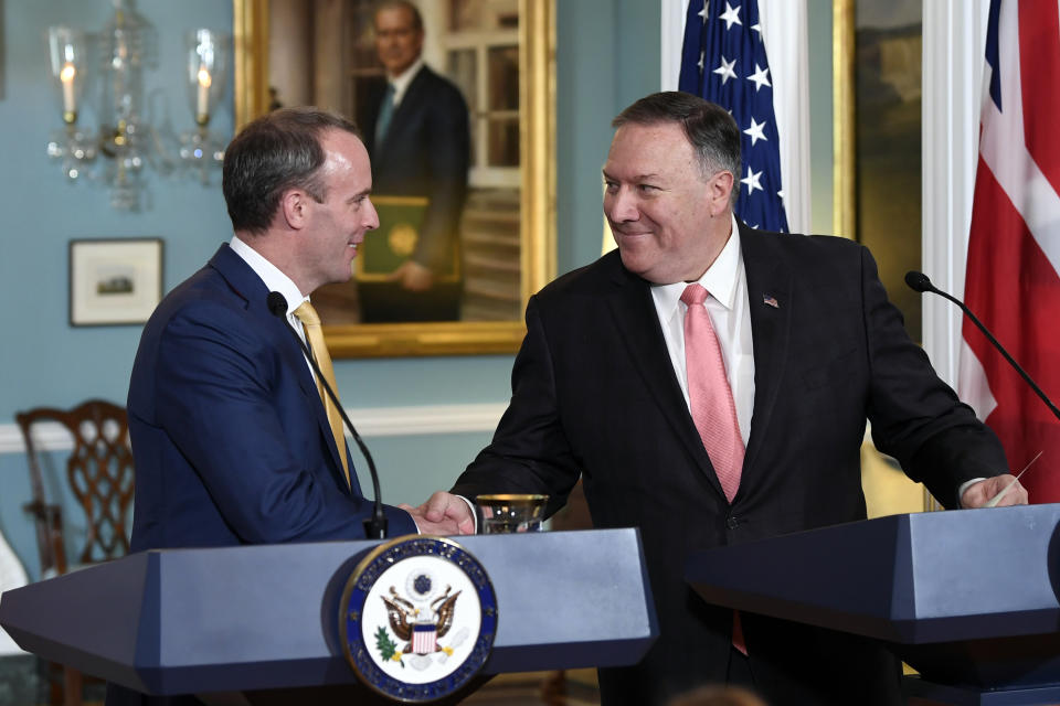 Secretary of State Mike Pompeo, right, shakes hands with Britain's Foreign Secretary Dominic Raab, left, during a press availability at the State Department in Washington, Wednesday, Aug. 7, 2019. (AP Photo/Susan Walsh)