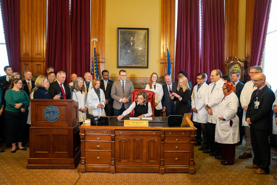 Governor Kim Reynolds signs a bill that will create a cap on noneconomic damages in medical malpractice cases, Thursday, Feb. 16, 2023.