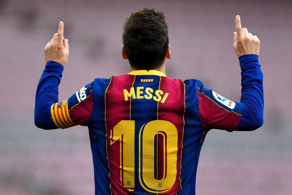 Barcelona's Argentine forward Lionel Messi celebrates after scoring a goal during the Spanish League football match between FC Barcelona  and RC Celta de Vigo at the Camp Nou stadium in Barcelona on May 16, 2021.