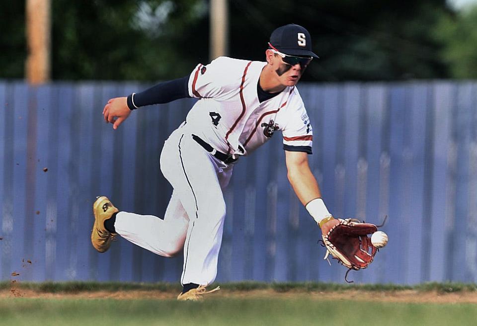 Lucky Horseshoe's Jayden Myren scoops up the ball and and throws to first for the out during the game against the Alton Dragons Saturday June 4, 2022. [Thomas J. Turney/ The State Journal-Register]