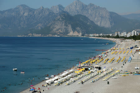 FILE PHOTO: Tourists enjoy a beach in the Turkish Mediterranean resort city of Antalya, a popular destination for both Turkish and foreign tourists. July 25, 2016. REUTERS/Kaan Soyturk/File Photo