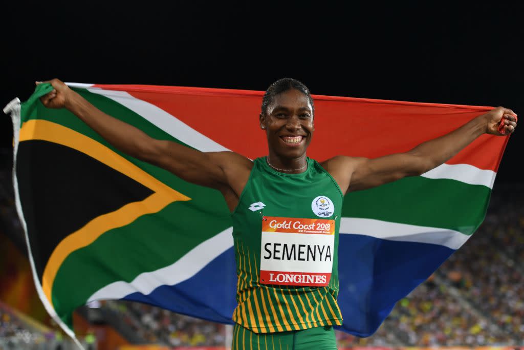 South Africa’s Caster Semenya celebrates with flag after winning the women’s 800-meter final during the 2018 Gold Coast Commonwealth Games on April 13. Critics of a new IAAF rule about female levels of testosterone say Semenya is the undeserving target. (Photo: Saeed Khan/AFP/Getty Images)