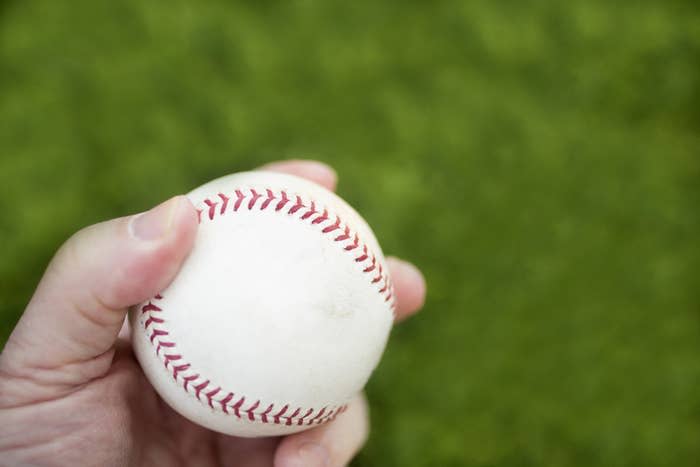 Left hand holding baseball