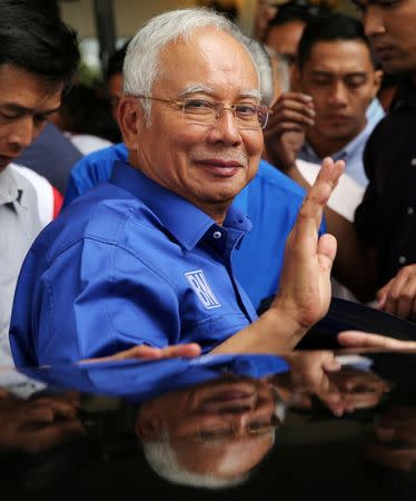 Malaysia's outgoing Prime Minister Najib Razak leaves after a news conference following the general election in Kuala Lumpur, Malaysia, May 10, 2018. REUTERS/Athit Perawongmetha/Files