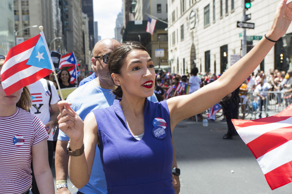 Rep. Alexandria Ocasio-Cortez (D-N.Y.) marches in the Puerto Rican Day Parade on June 9 in Manhattan. She has endorsed Cab&aacute;n, a fellow Puerto Rican with a humble upbringing. (Photo: Erin Lefevre/NurPhoto/Getty Images)