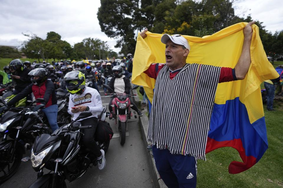 A man shouts slogans against the government during a caravan to protest the increase in gas prices in Bogota, Colombia, Monday, Aug. 28, 2023. (AP Photo/Fernando Vergara)