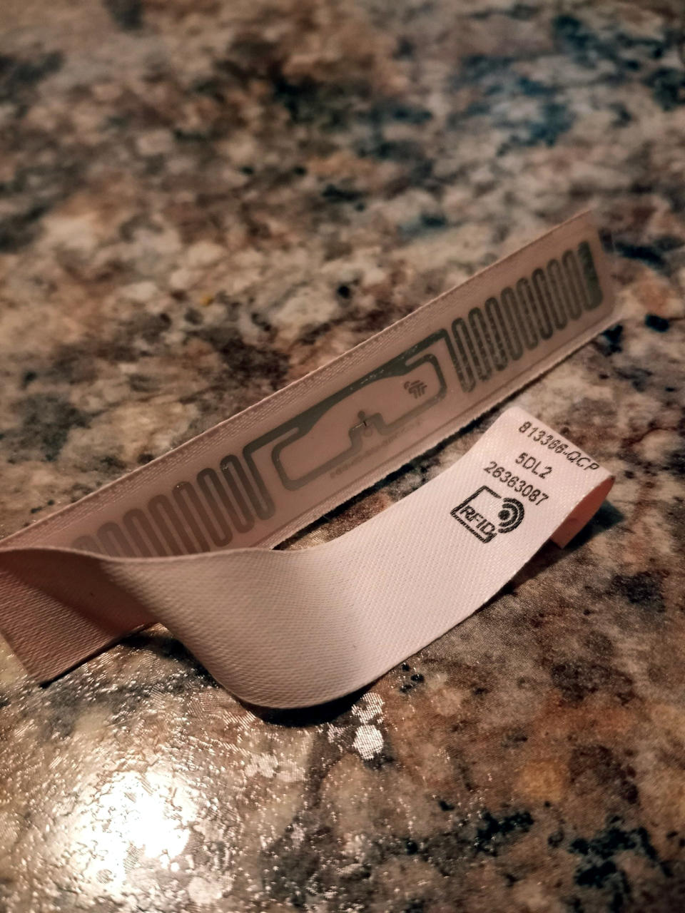 An RFID tag attached to an online purchase from Victoria’s Secret.   (Marie Hartley)
