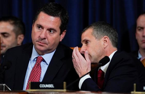 Republican counsel Steve Castor whispers to Devin Nunes during evidence by George Kent and William Taylor at the impeachment hearings into Donald Trump (REUTERS)