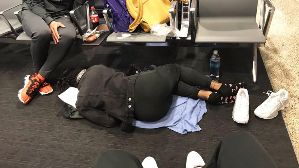 WNBA star Natalia Achonwa posted this image of her Indiana Fever teammate sleeping on the floor at an airport to demonstrate the divide between the WNBA and the NBA. The latter almost always travel on private flights, a luxury not afforded to the WNBA. Picture: Twitter/@NatAchon