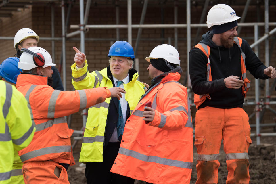 Prime Minister Boris Johnson (centre) during a visit to David Wilson Homes in Bedford while on the campaign trail for the General Election.