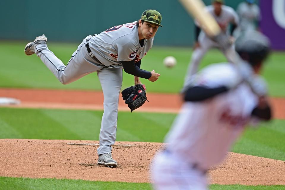 Detroit Tigers starting pitcher Alex Faedo, left, delivers to Cleveland Guardians' Myles Straw in the first inning of a baseball game, Sunday, May 22, 2022, in Cleveland. (AP Photo/David Dermer)