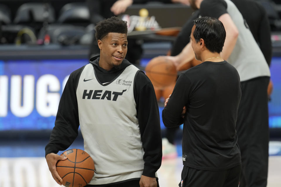 Miami Heat guard Kyle Lowry, left, chats with head coach Erik Spoelstra as players take part in practice for Game 1 of the NBA basketball finals against the Denver Nuggets Wednesday, May 31, 2023, in Denver. The Heat face the Denver Nuggets in Game 1 of the NBA Finals Thursday. (AP Photo/David Zalubowski)