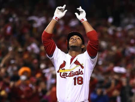 St. Louis Cardinals pinch hitter Oscar Taveras (18) celebrates after hitting a solo home run against the San Francisco Giants during the 7th inning in game two of the 2014 NLCS playoff baseball game at Busch Stadium on October 12, 2014. Jasen Vinlove-USA TODAY Sports