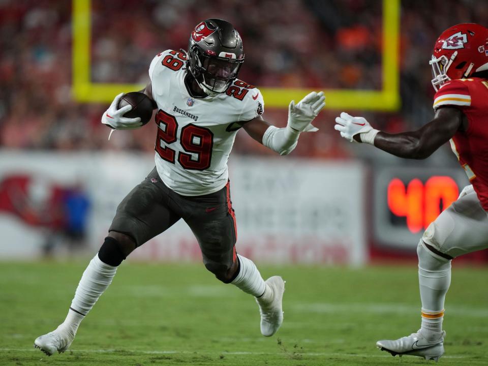 Rachaad White makes a run against the Kansas City Chiefs.