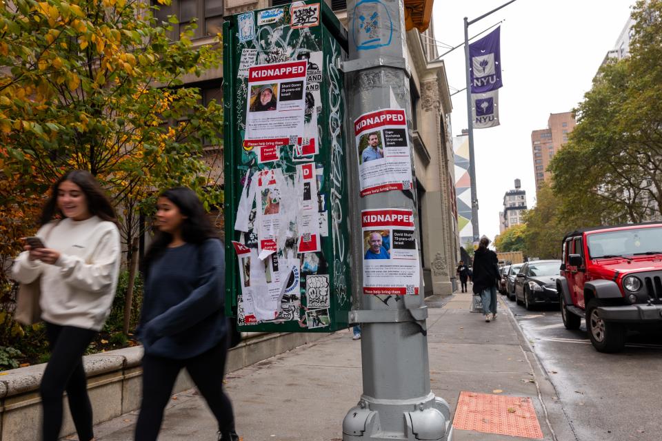 NEW YORK, NEW YORK - OCTOBER 30: Posters of some of those kidnapped by Hamas in Israeli are displayed on a pole outside of New York University (NYU) as tensions between supporters of Palestine and Israel increase on college campuses across the nation on October 30, 2023 in New York City. The Biden administration is announcing new actions in an attempt to crack down on antisemitic incidents on college campuses following the Hamas terror attacks on Israel. Many Jewish and Israeli students have felt threatened after large and vocal demonstrations against the fighting in Gaza broke out at numerous universities. (Photo by Spencer Platt/Getty Images) ORG XMIT: 776055985 ORIG FILE ID: 1765390958