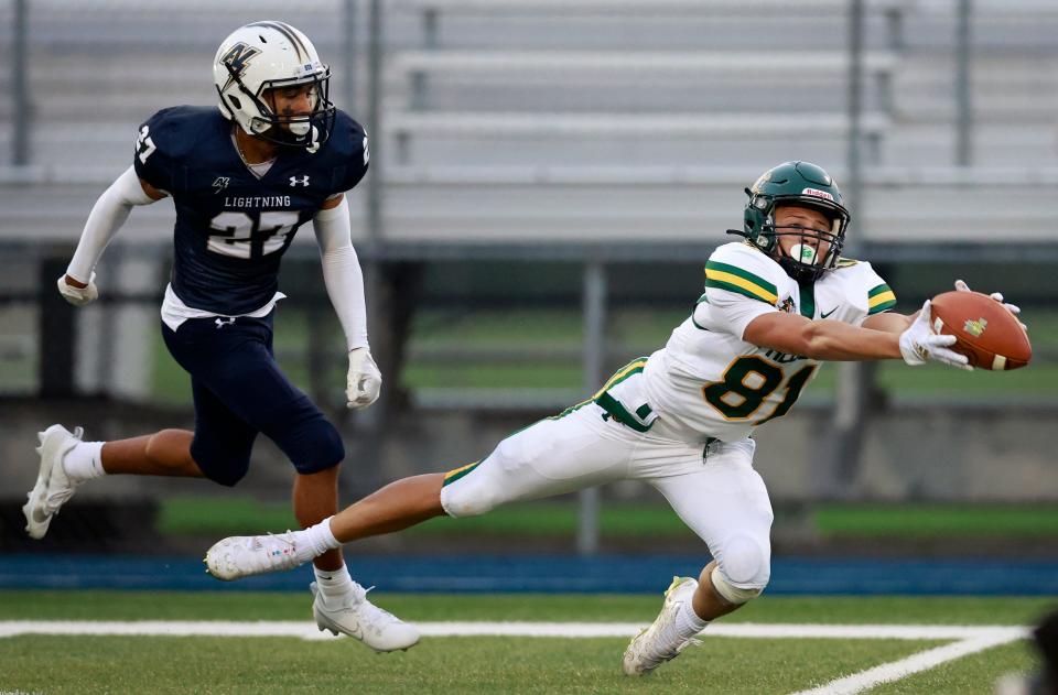 Green Bay Preble's Alex VanRoy (81) makes a diving catch against Appleton North's Jabari Hammond (27) during an Aug. 24 nonconference game.