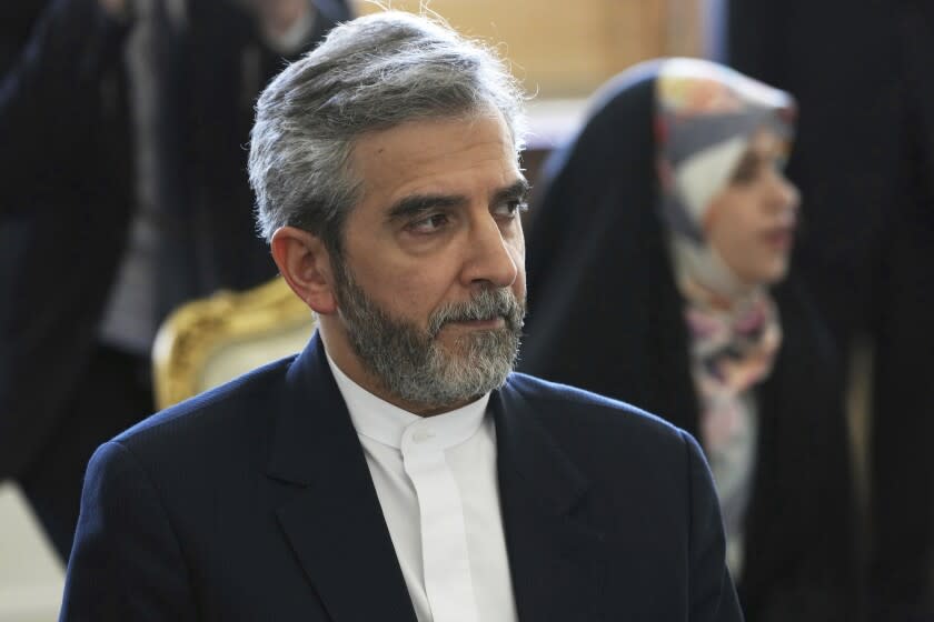 FILE - Iran's top nuclear negotiator Ali Bagheri Kani listens to Russian Foreign Minister Sergey Lavrov during a meeting in Tehran, Iran, June 23, 2022. Iran and the United States appear poised to start indirect talks in Qatar aimed at finding a way to save Tehran's tattered nuclear deal with world powers. The state-owned Tehran Times posted a photograph on Tuesday, June 28, 2022, of Kani, in a hotel lobby with Iranian Ambassador to Qatar Hamidreza Dehghani. (AP Photo/Vahid Salemi, File)