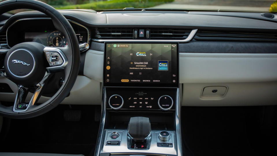 The interior of the XF features a sculpted steering wheel, taken from the I-Pace, and a large touch-sensitive central screen. - Credit: Jaguar Land Rover Automotive PLC.