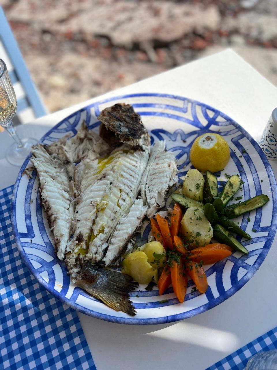 A whole filleted fish on a plate.