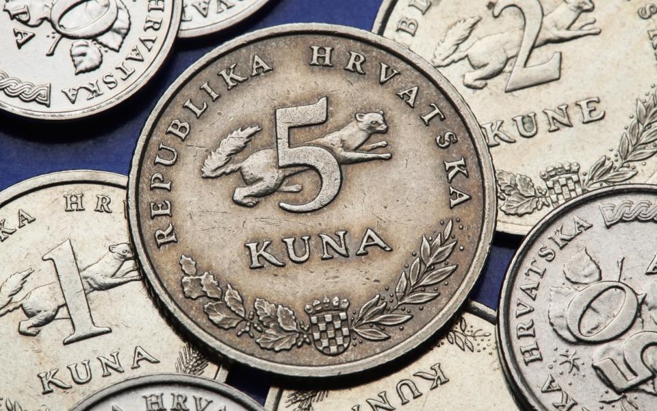 Croatian national coat of arms and marten depicted in the Croatian five kuna coin - Getty