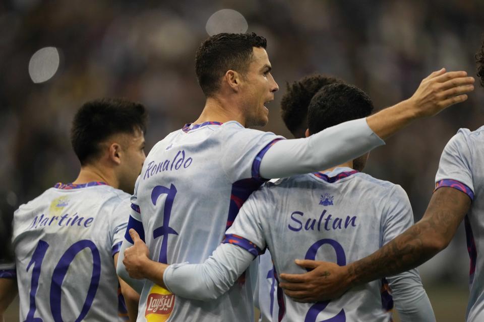 Cristiano Ronaldo celebrates after scoring his side's second goal playing for a combined XI of Saudi Arabian teams Al Nassr and PSG during a friendly soccer match, at the King Saud University Stadium, in Riyadh, Saudi Arabia, Thursday, Jan. 19, 2023. (AP Photo/Hussein Malla)