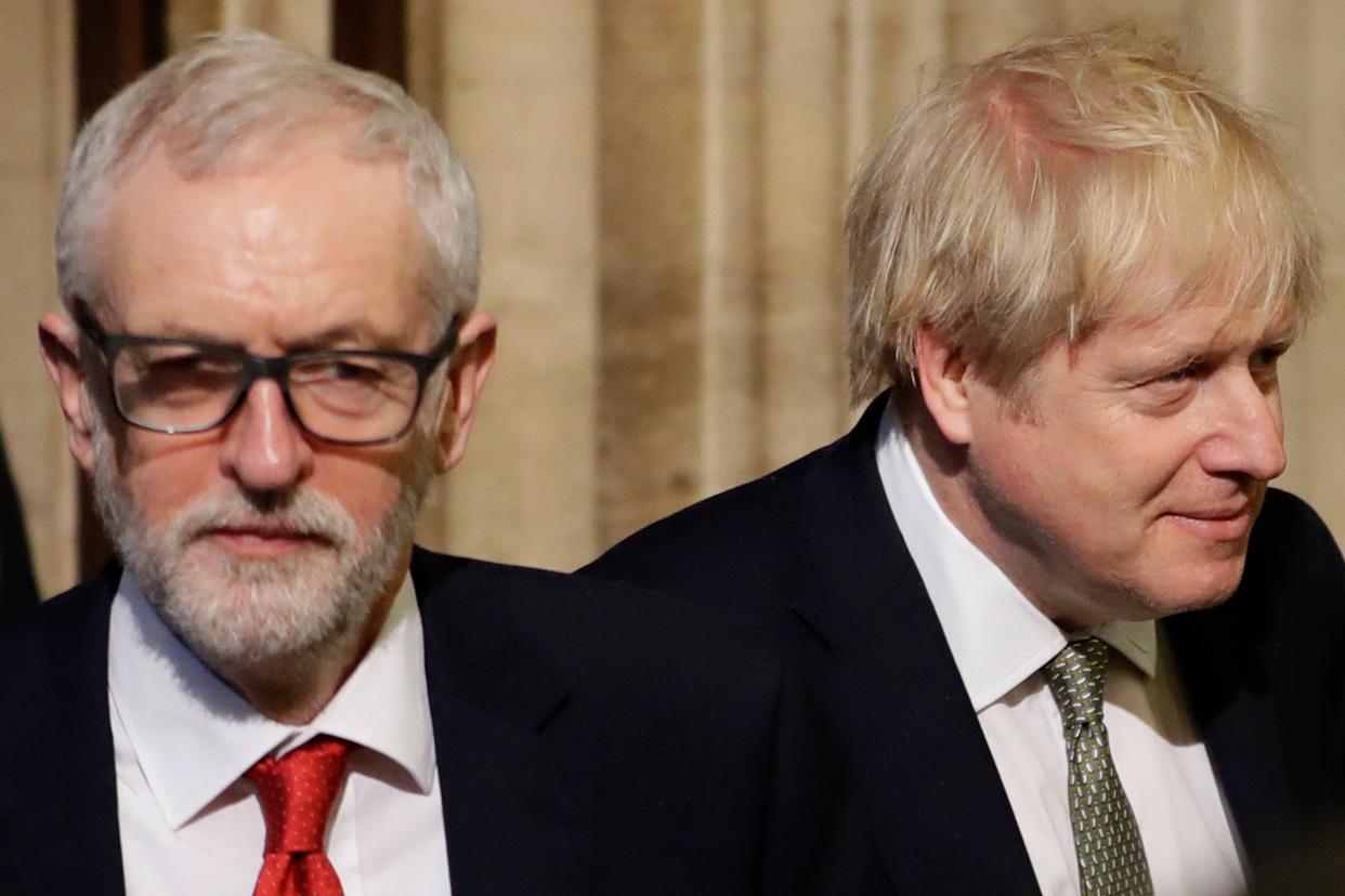 Britain's Prime Minister Boris Johnson (R) and Labour Party Leader Jeremy Corbyn (L) walk through the Commons Members Lobby during the State Opening of Parliament at the Houses of Parliament in London on December 19, 2019. - The State Opening of Parliament is where Queen Elizabeth II performs her ceremonial duty of informing parliament about the government's agenda for the coming year in a Queen's Speech. (Photo by Kirsty Wigglesworth / POOL / AFP) (Photo by KIRSTY WIGGLESWORTH/POOL/AFP via Getty Images)