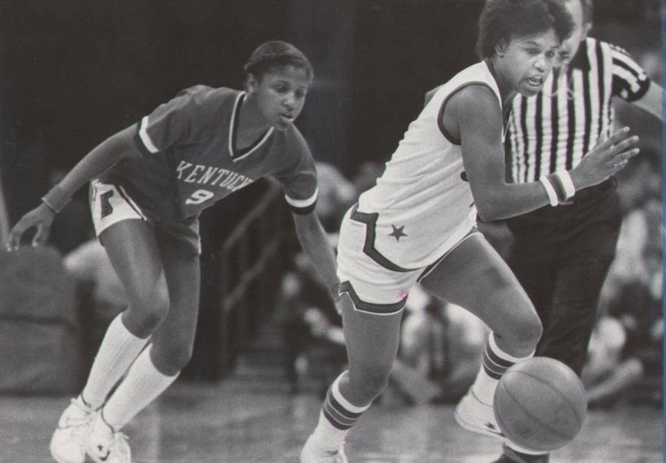 1981 Miss Basketball Cheryl Cook wins the chase for the loose ball against Kentucky's Gina Brown.