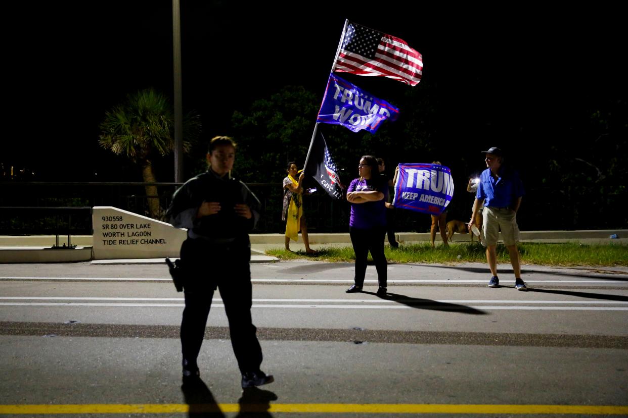 Supporters of former President Donald Trump rally near his home at Mar-A-Lago on August 8, 2022 in Palm Beach, Florida. The FBI raided the home to retrieve classified White House documents. 