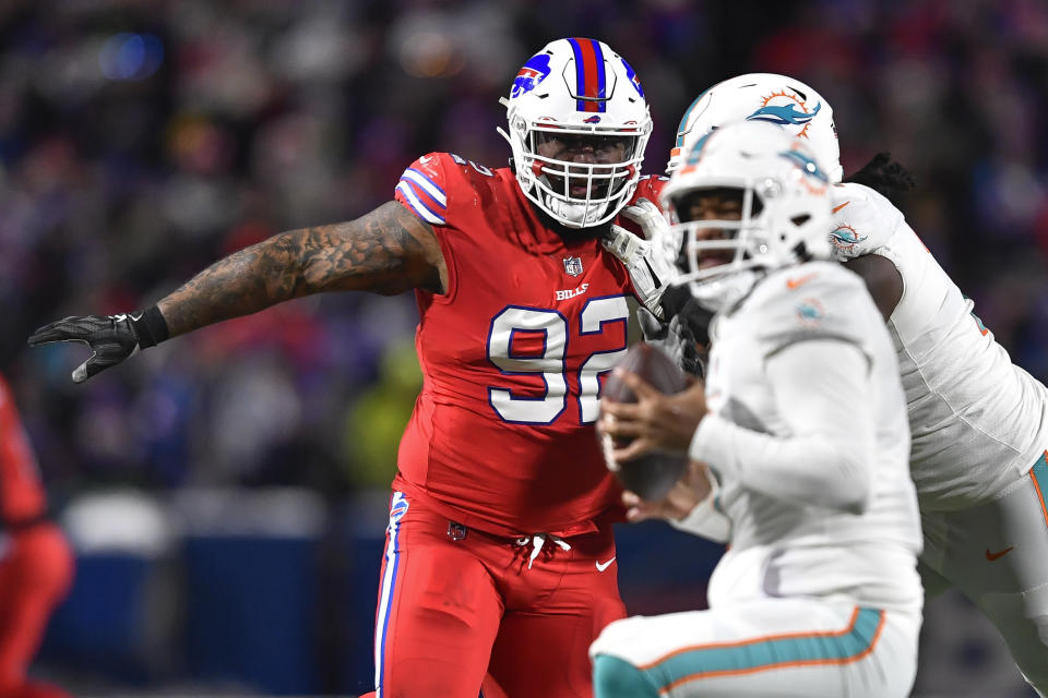 FILE - Buffalo Bills defensive tackle DaQuan Jones (92) pressures Miami Dolphins quarterback Tua Tagovailoa (1) during the second half of an NFL football game in Orchard Park, N.Y., Saturday, Dec. 17, 2022. The Buffalo Bills reached an agreement to re-sign veteran defensive lineman DaQuan Jones to a two-year contract on Tuesday, March 12, 2024. (AP Photo/Adrian Kraus, File)