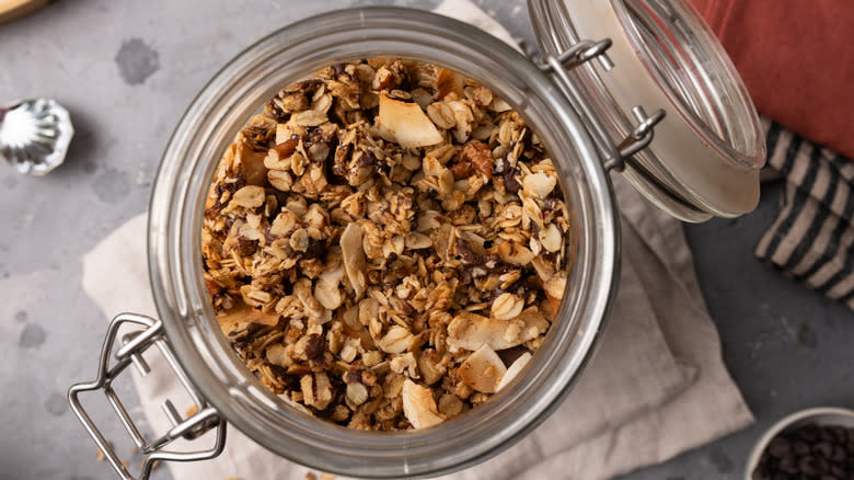 granola in a glass container, top-down view